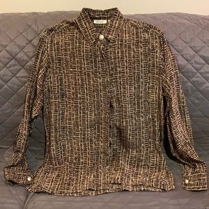 100% silk blouse by Reve. Like new.